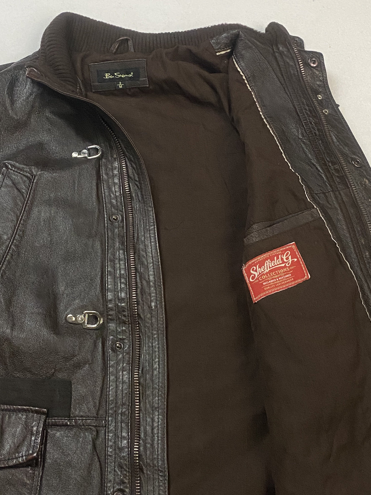 Brown real leather field jacket with a 25 inch sleeve, size XL