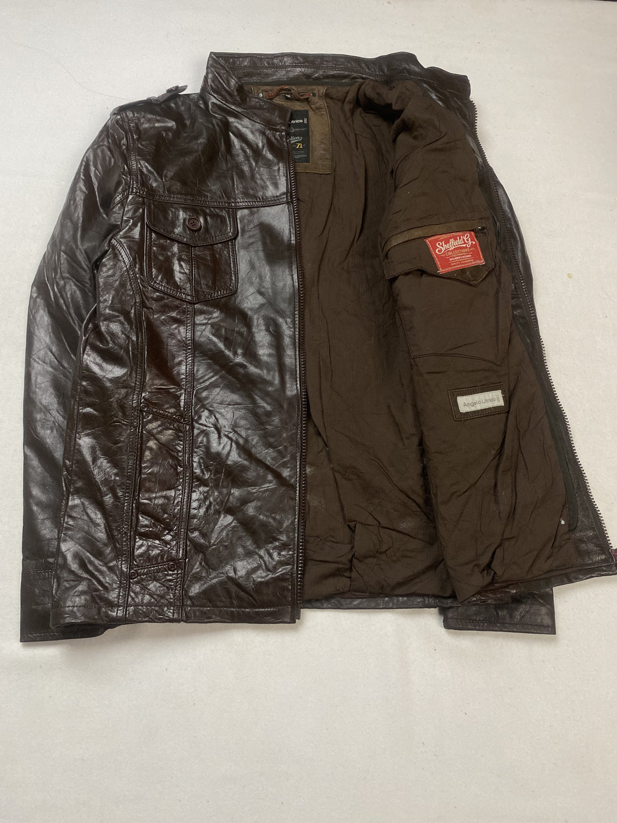 Brown field jacket held open to show the full brown lining and inside pocket