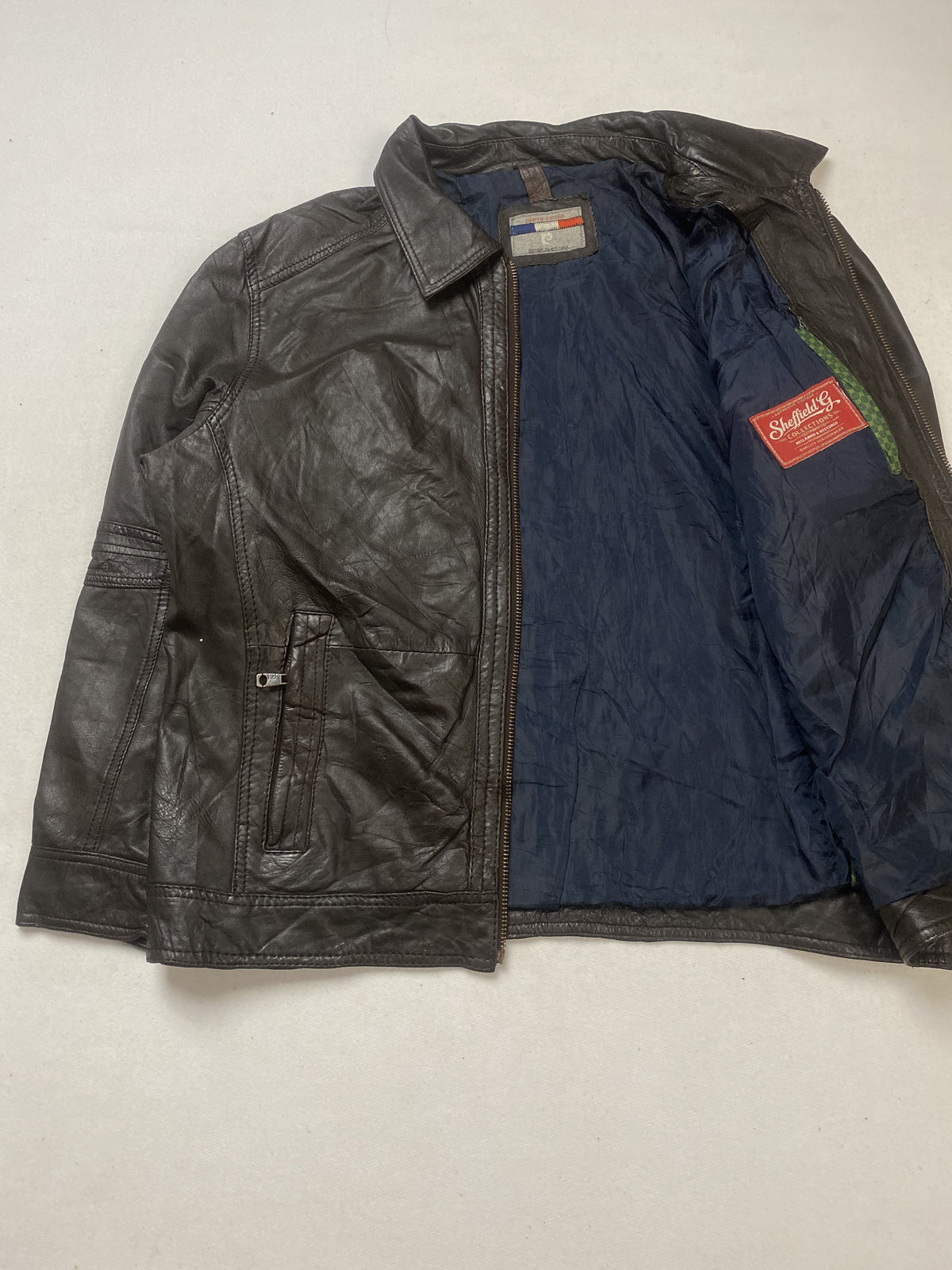 The size XXL brown harrington, 28 inches long through the body
