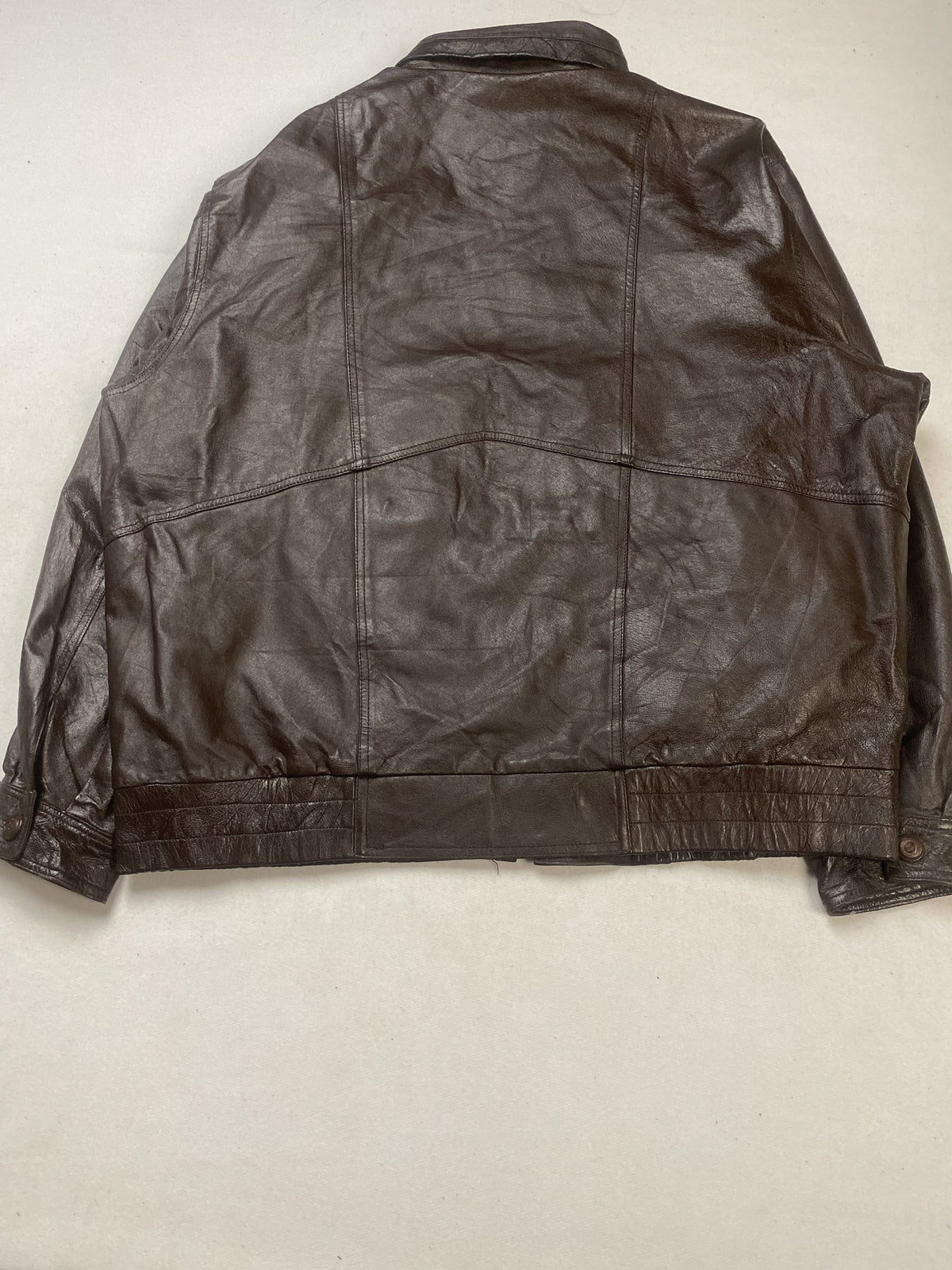 Chest pocket on the front of the brown leather trucker jacket