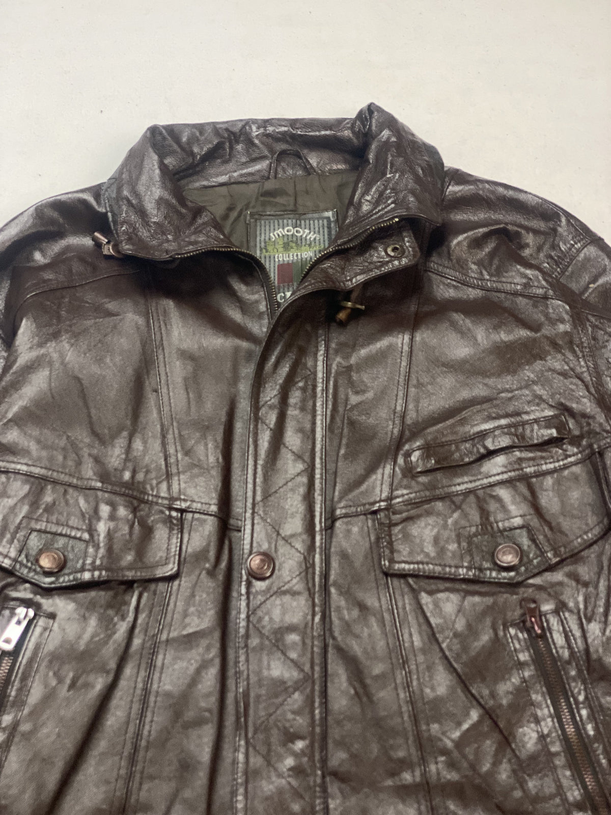 The size XL brown trucker, 25 inches long through the body