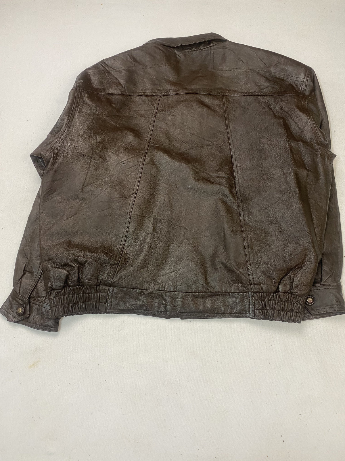 Quilted lining inside the brown leather jacket
