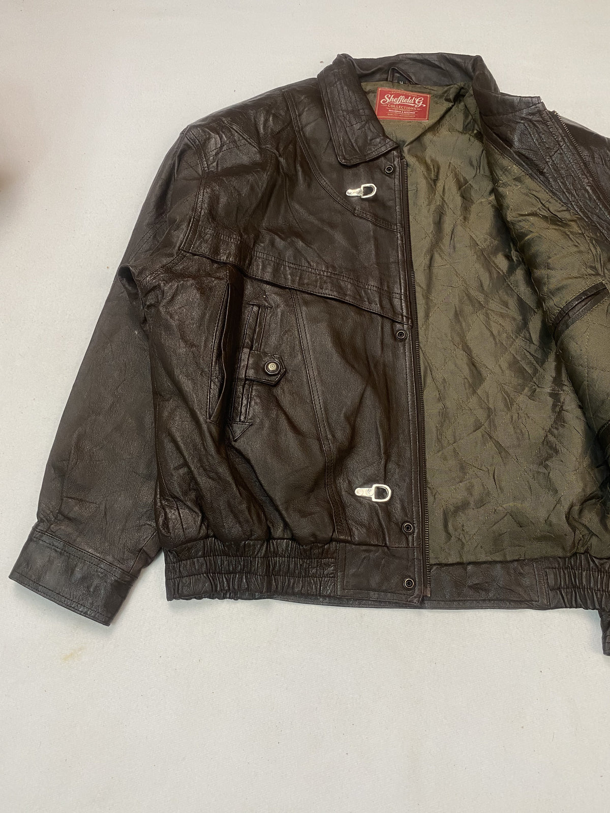The size XL brown jacket, 27 inches long through the body