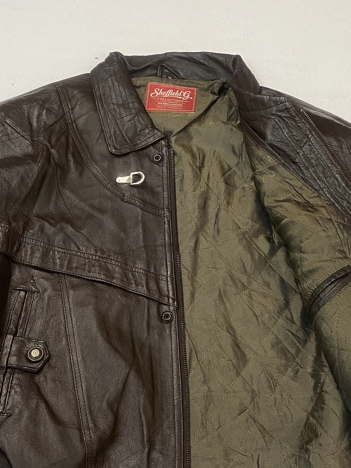 Broad shouldered brown leather jacket in size XL, 24 inches across