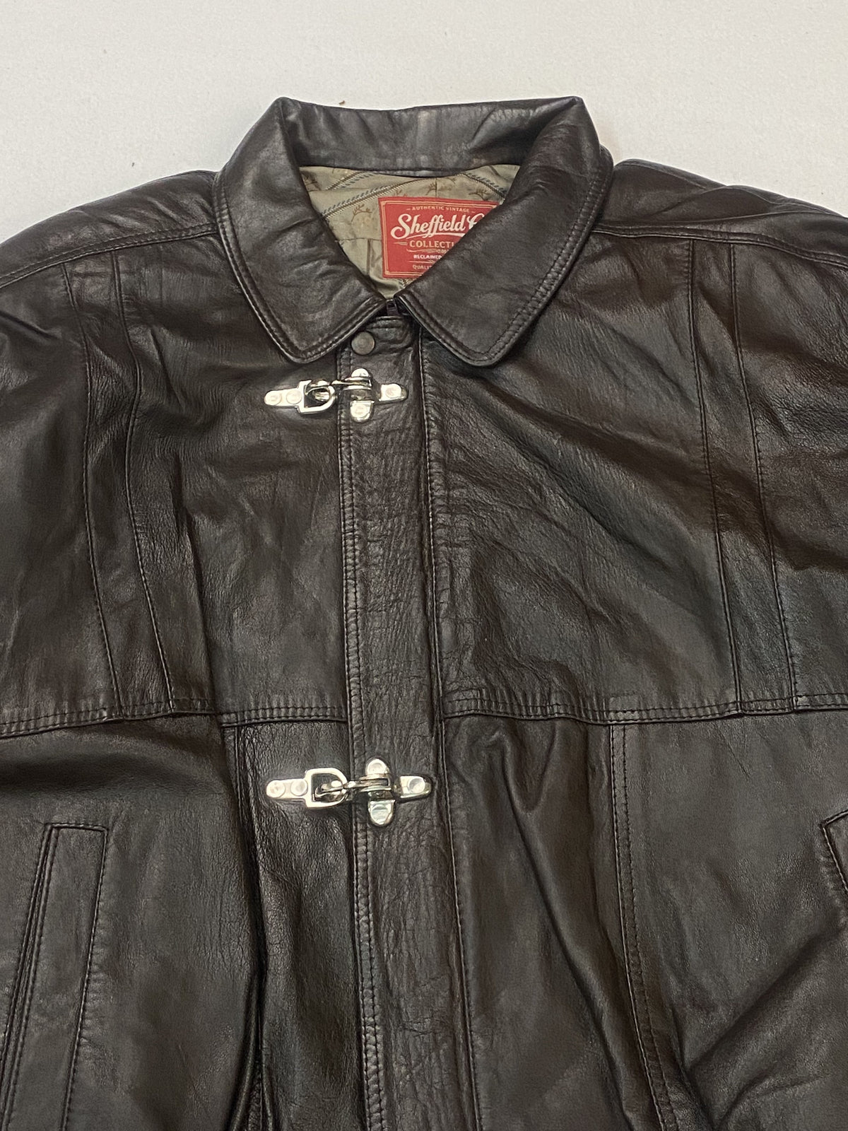 The size XXL brown harrington, 26 inches long through the body
