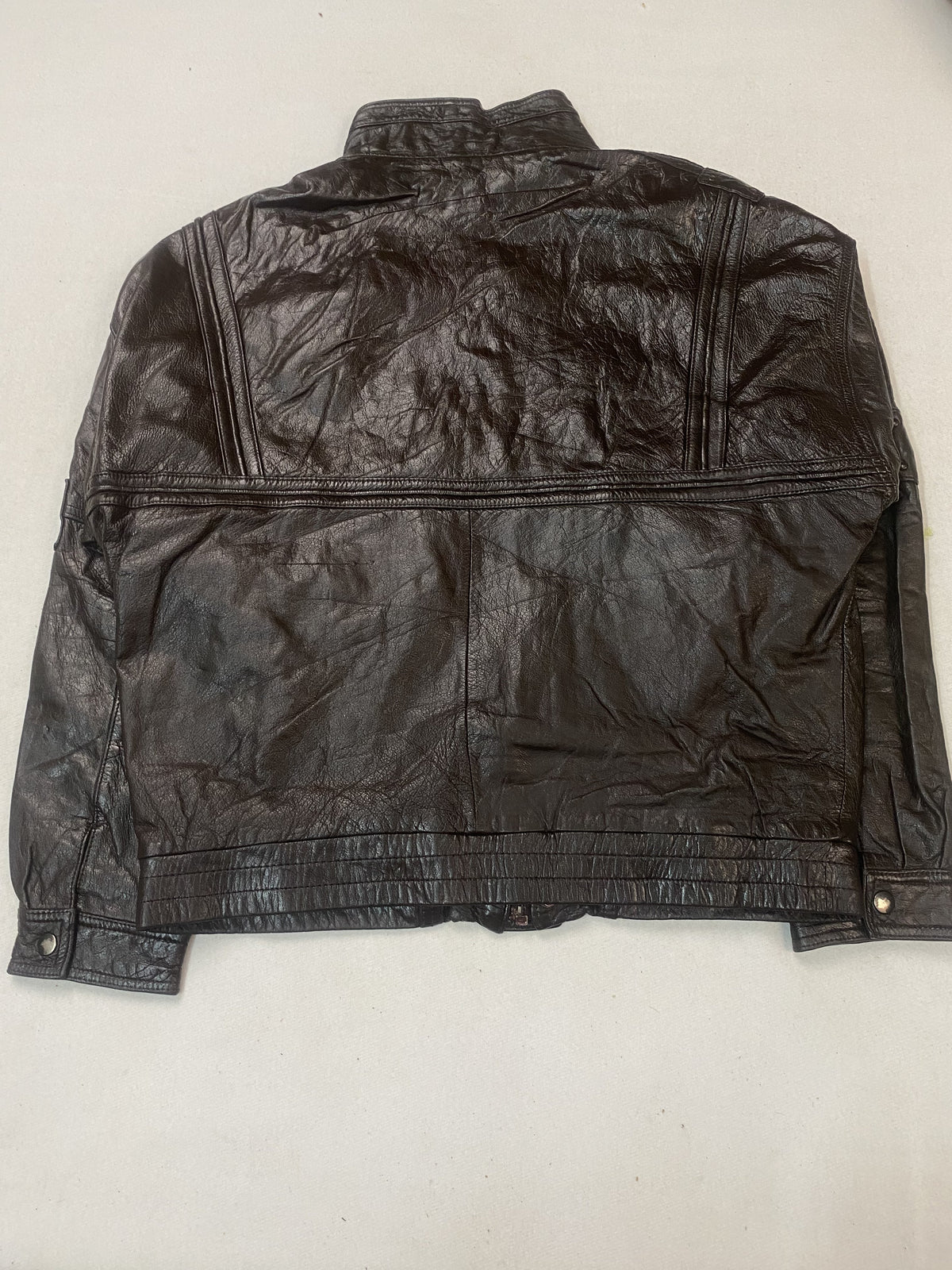 Back of the roomy XXL jacket laid flat, plain leather above a gathered waistband