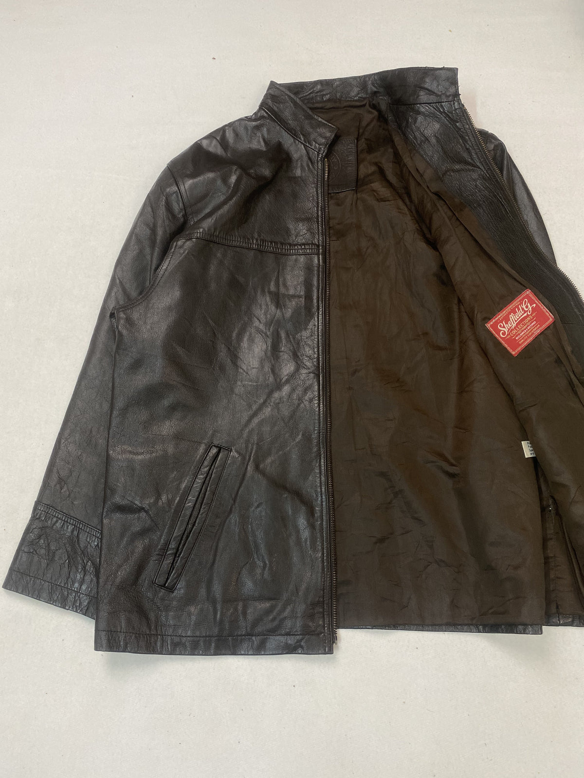 Broad shouldered brown leather cafe racer jacket in size L