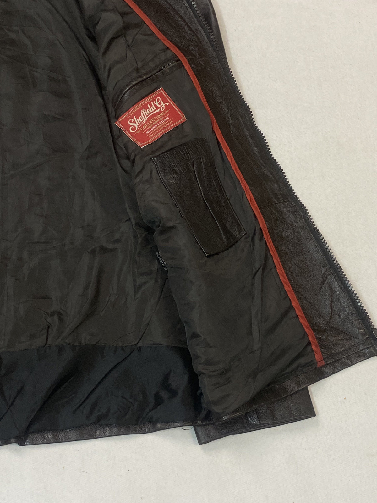 Brown real leather cafe racer with a 23 inch sleeve, size L