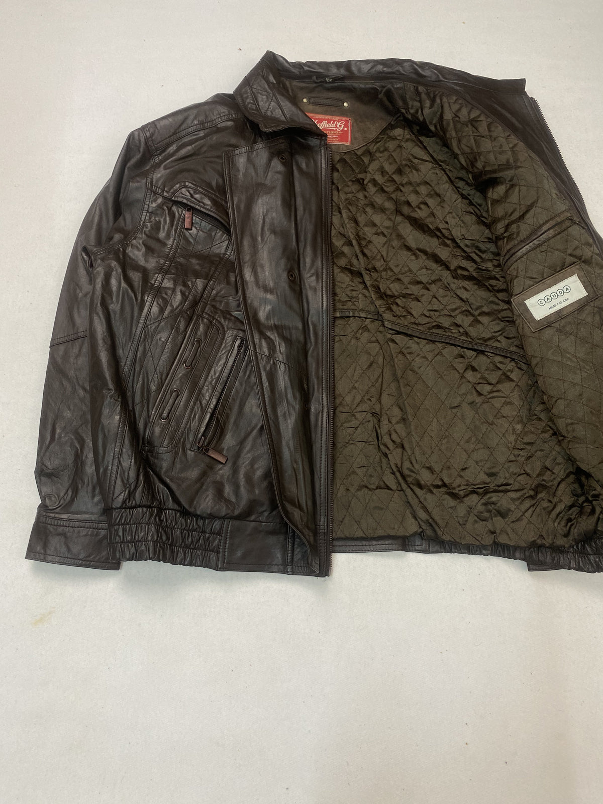 Brown real leather harrington with a 25 inch sleeve, size XL