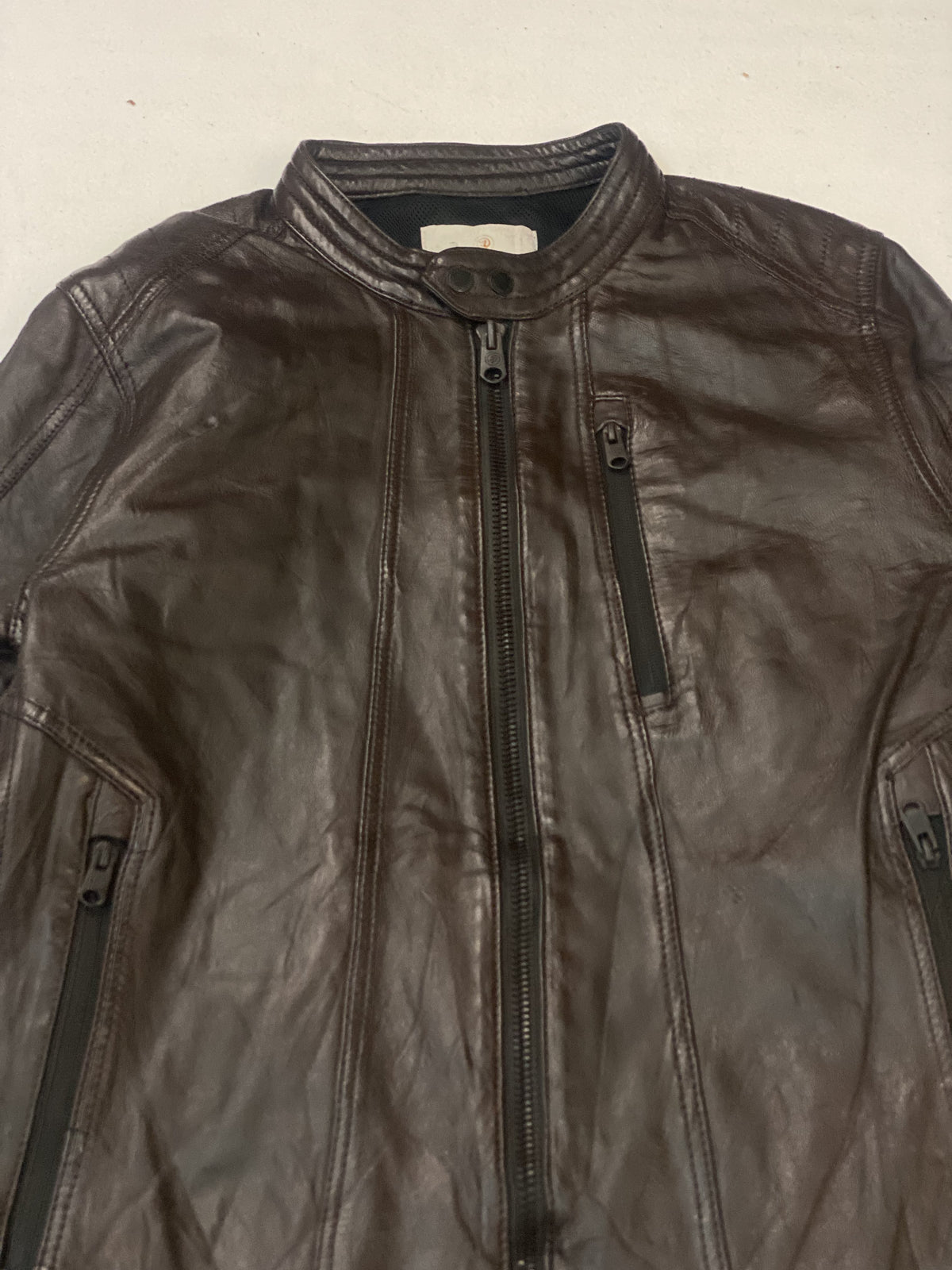 The size M brown cafe racer, 27 inches long through the body