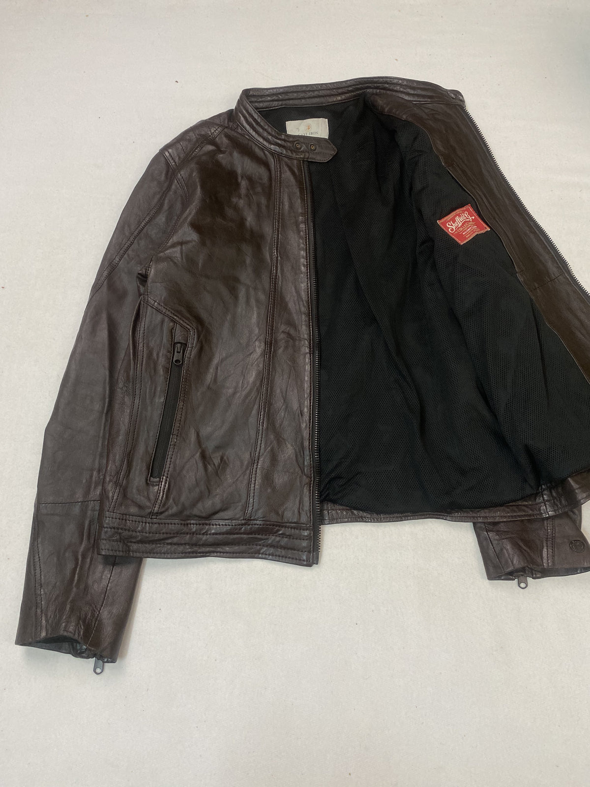 Slim shouldered brown leather cafe racer jacket in size M