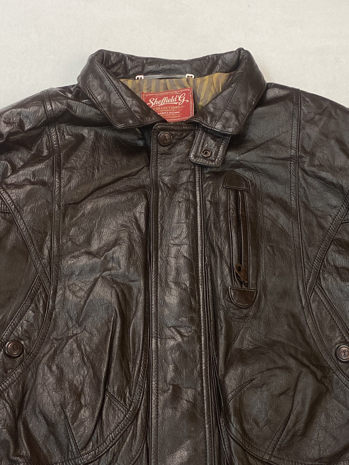 The size XXL brown harrington, 25 inches long through the body