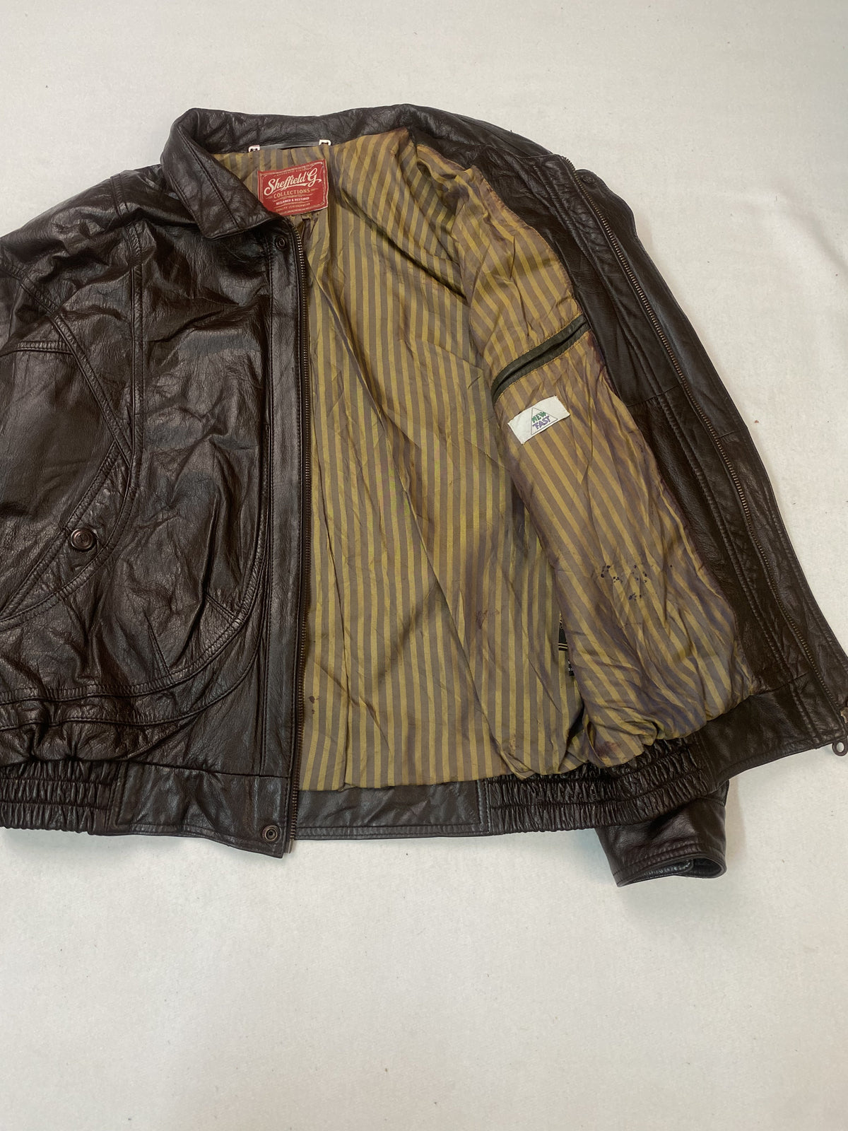 Broad shouldered brown leather harrington in size XXL, 24 inches across
