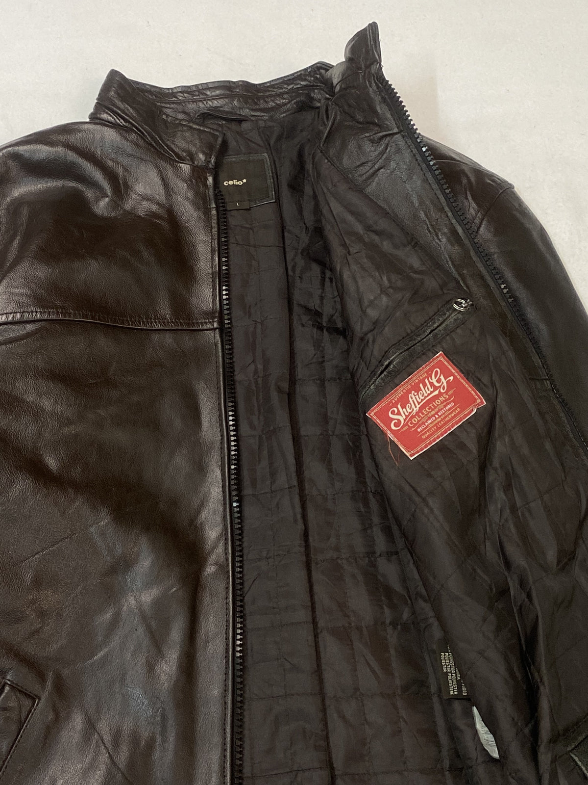Quilted lining and the small woven label inside the open front of the cafe racer