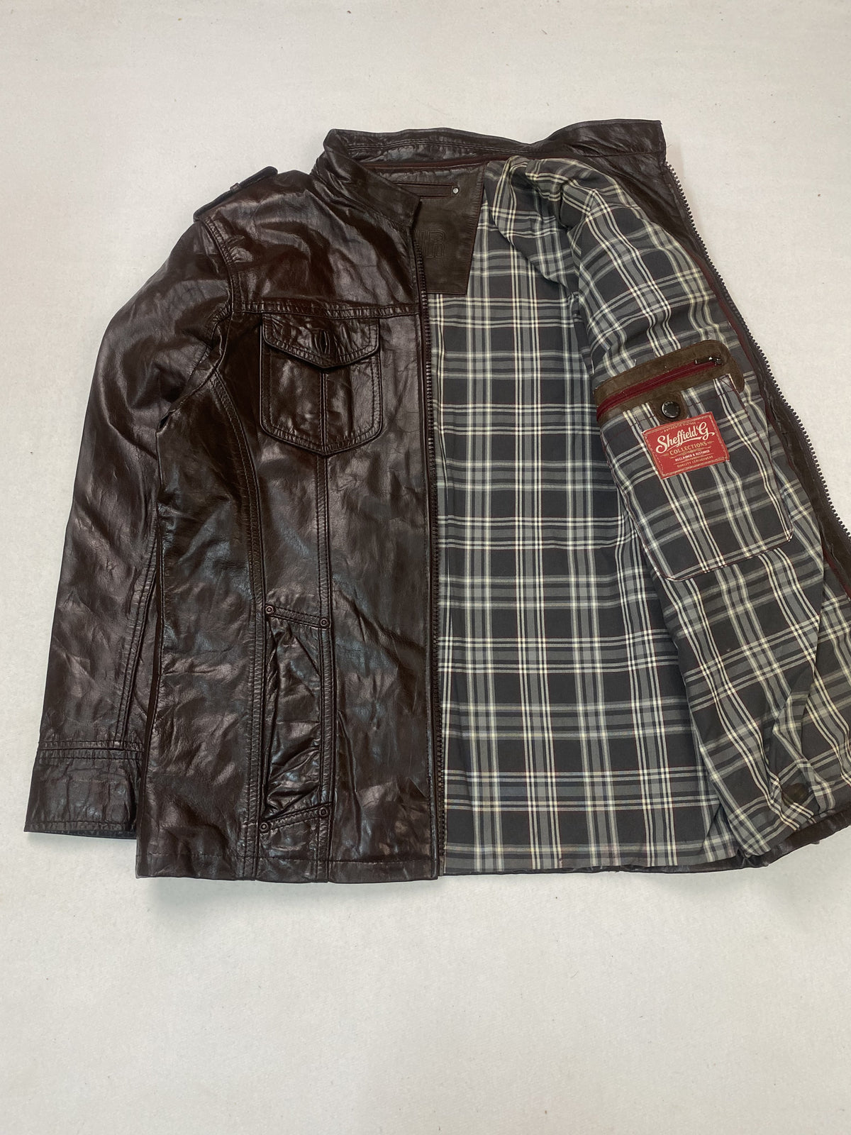 Size L trucker in brown real leather with a 22 inch chest