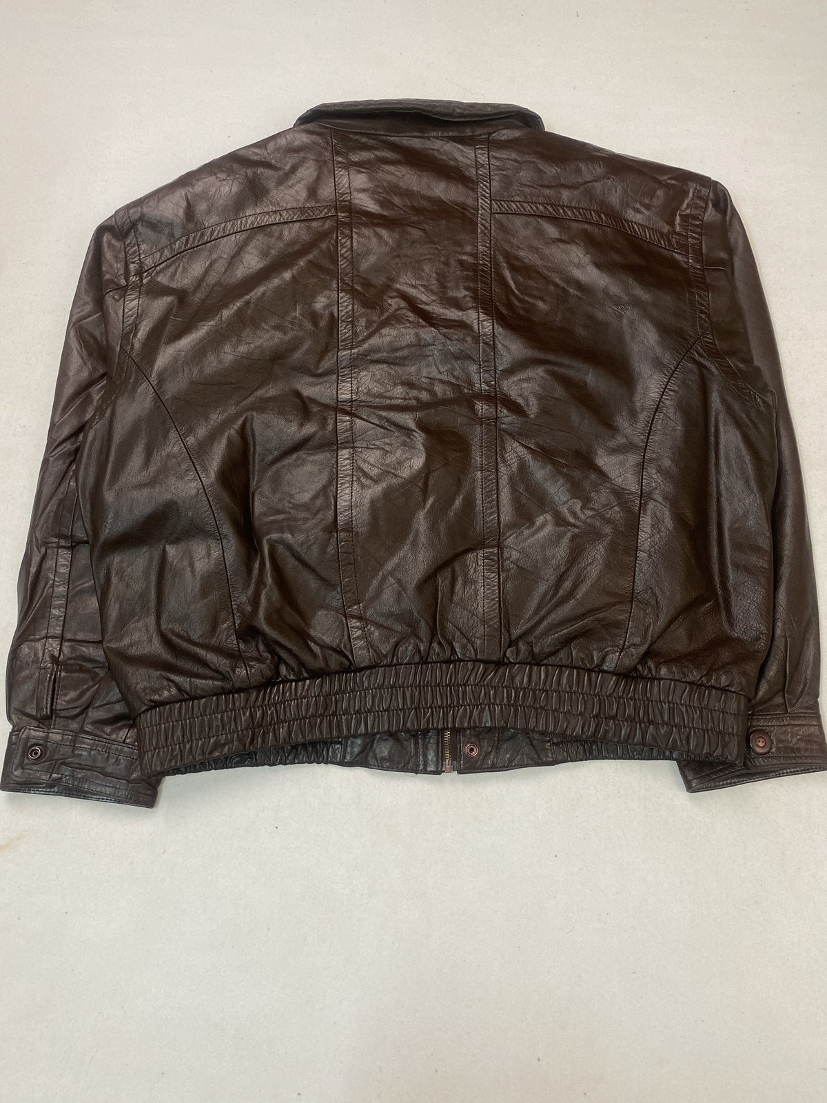 Brown leather jacket in size XXL shown from the front with hook clasp fastenings
