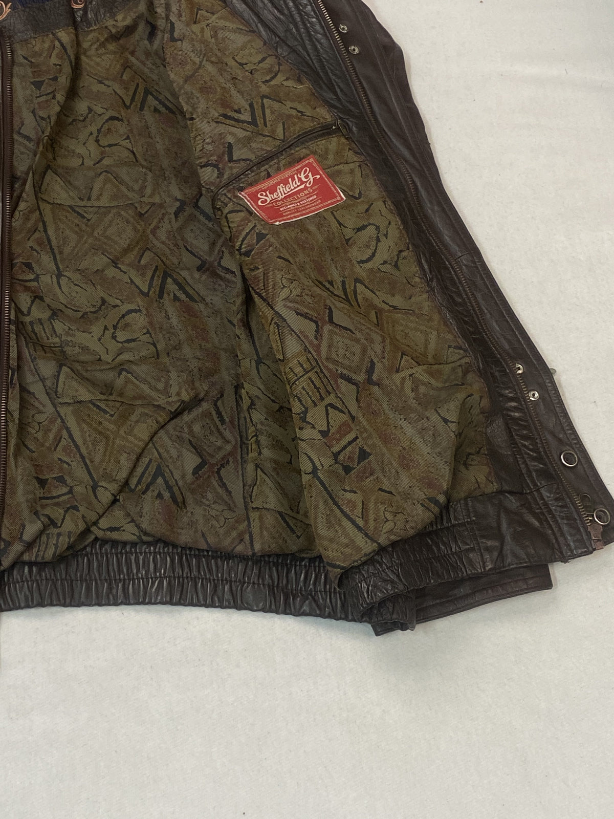 The size XXL brown jacket, 26 inches long through the body