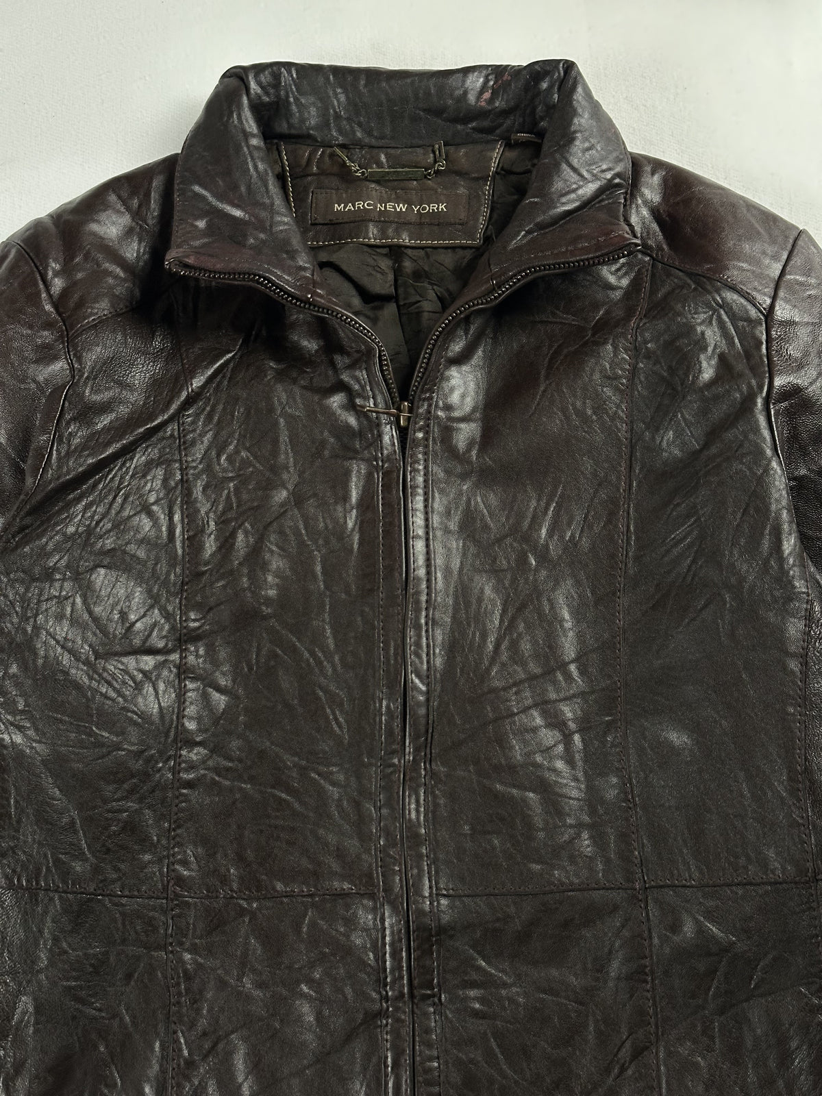The size M brown jacket, 25 inches long through the body