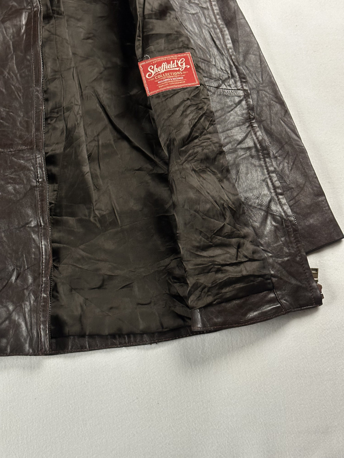 Brown real leather jacket with a short 19 inch sleeve, size M