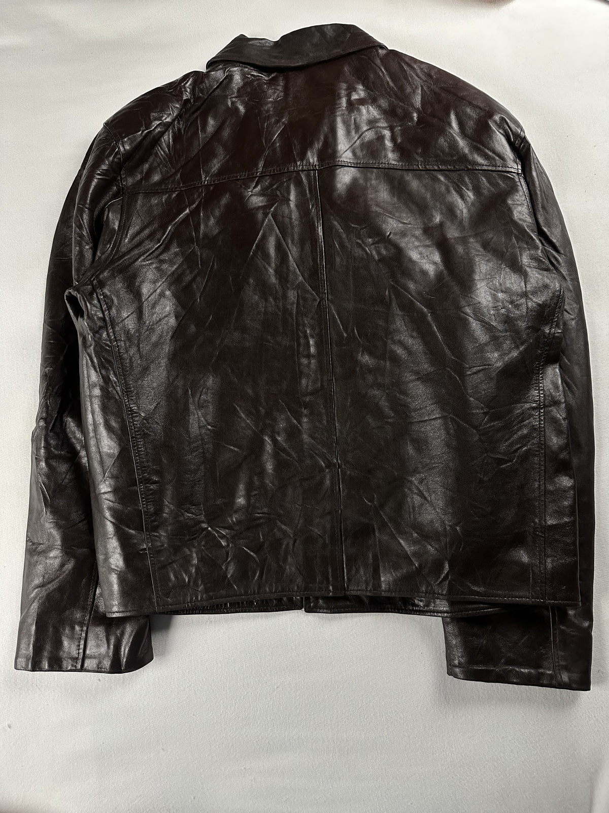 Back of the size L brown jacket laid flat, showing the plain leather panel and centre seam