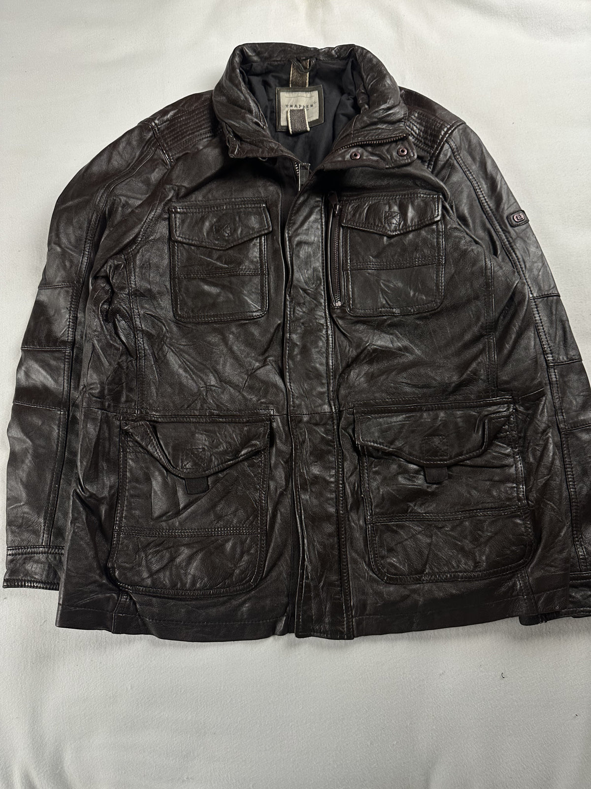 Pocket detail on the brown leather field jacket in size XL