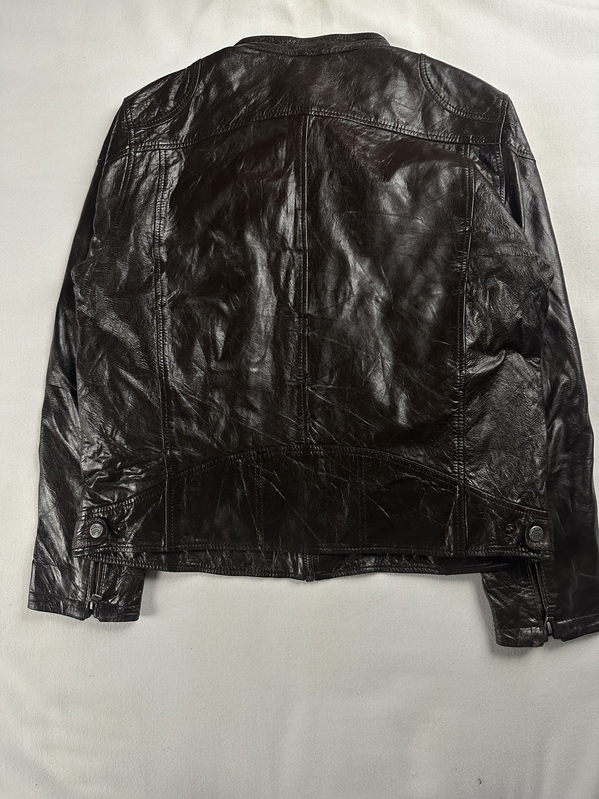 Zipped chest pocket on the brown leather cafe racer