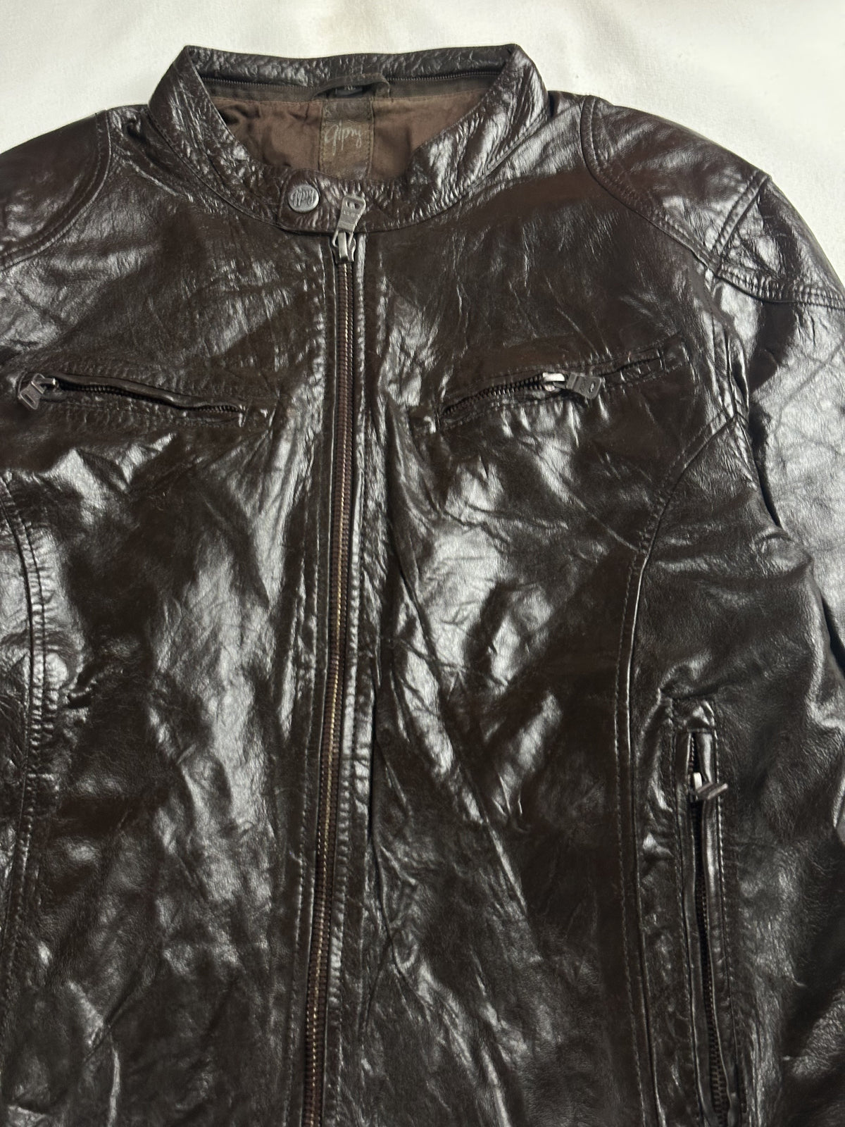 The size M brown cafe racer, 26 inches long through the body
