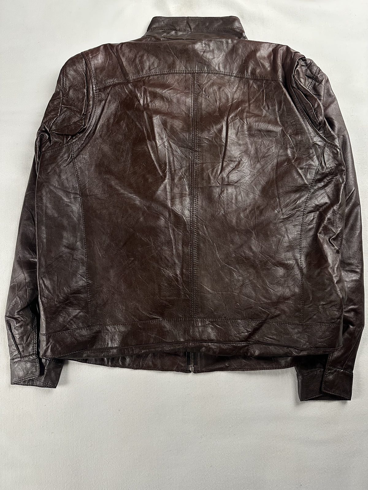 Twin zip pockets set into the brown leather front