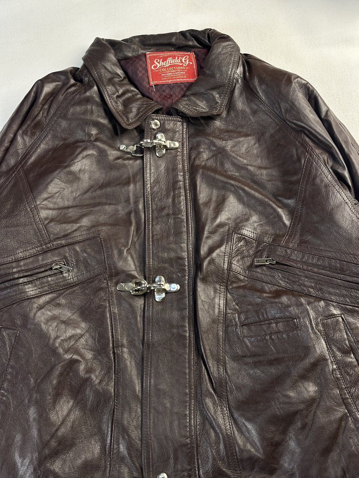 Brown leather jacket in very good condition, shown in size L