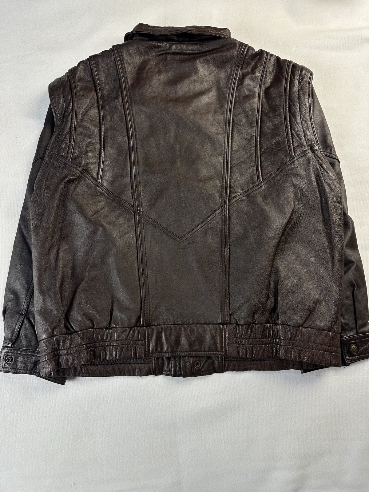 Quilted lining inside the brown leather harrington