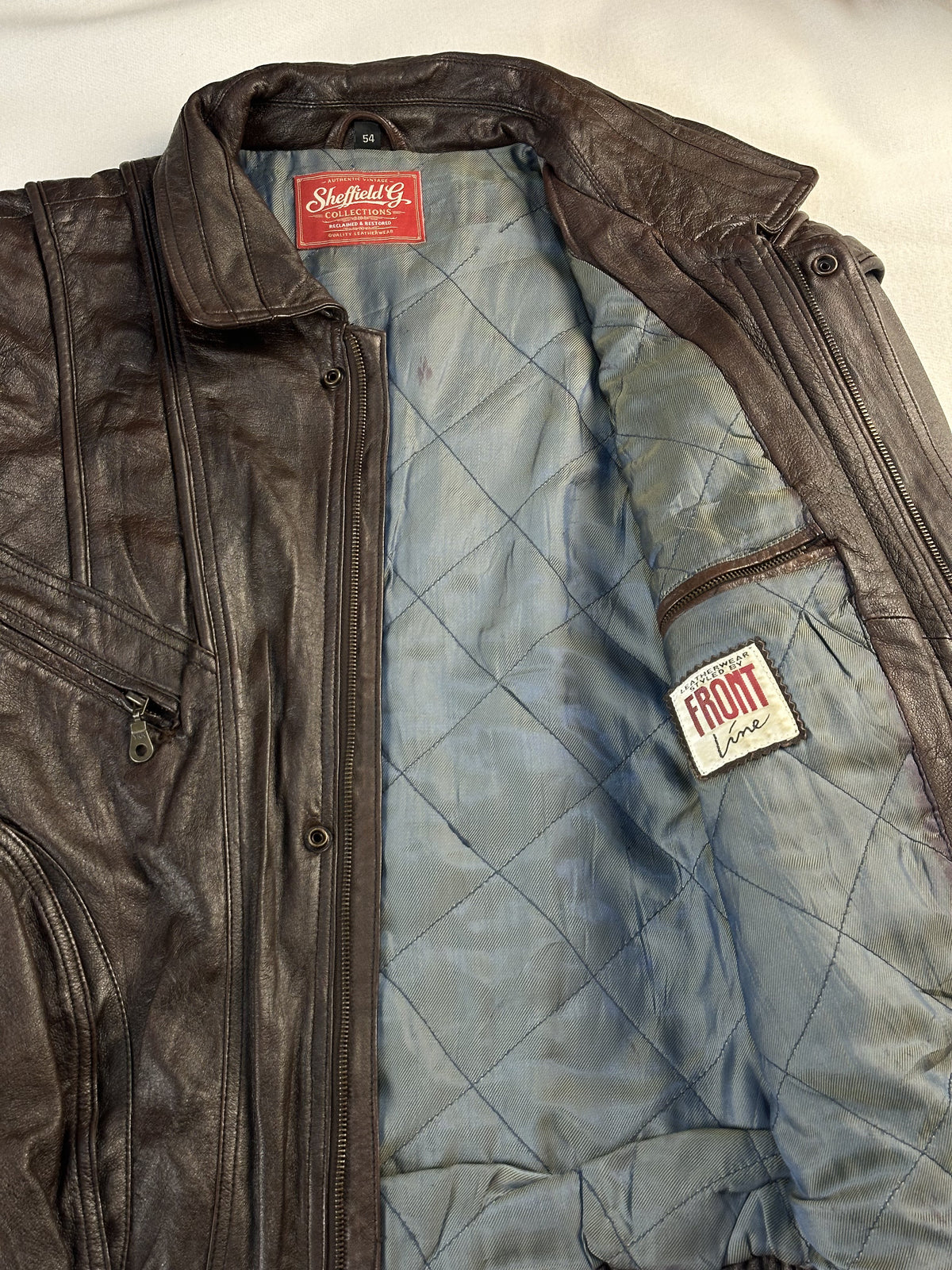 Brown real leather harrington with a 24 inch sleeve, size XL