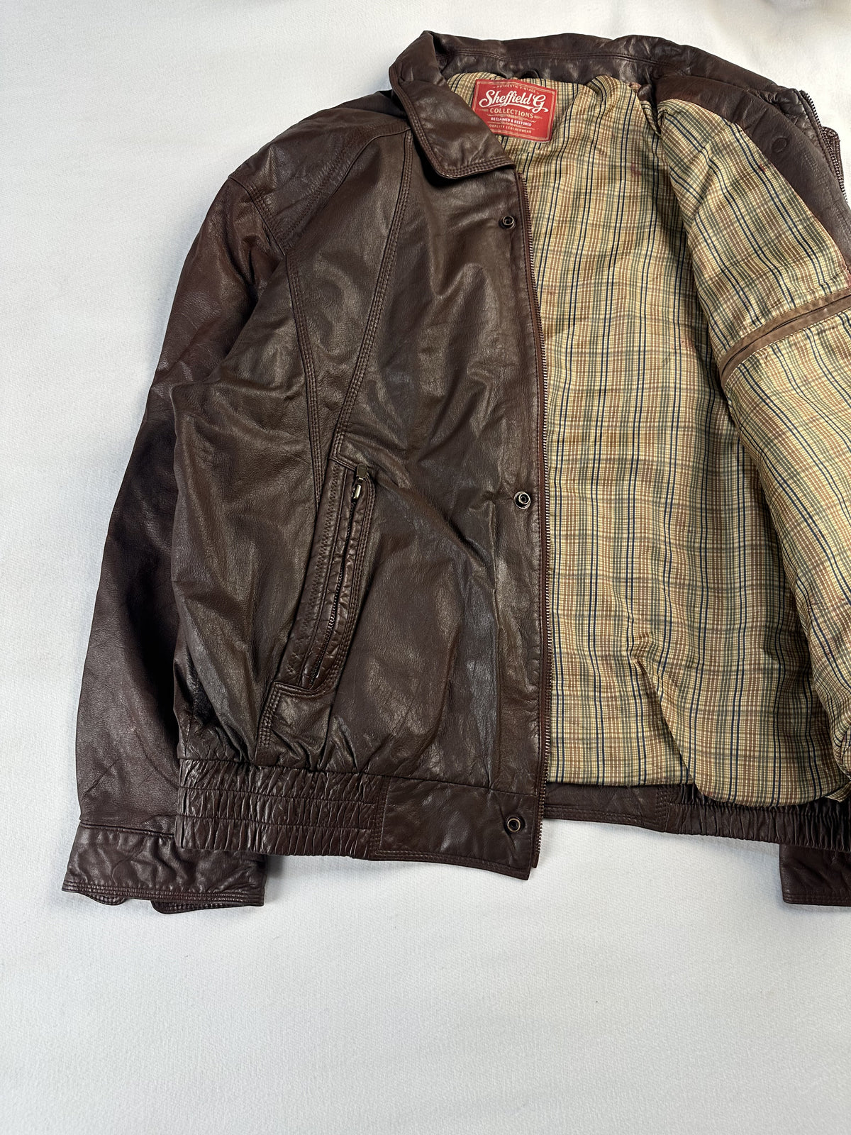 Tartan lined brown leather harrington jacket in size XL