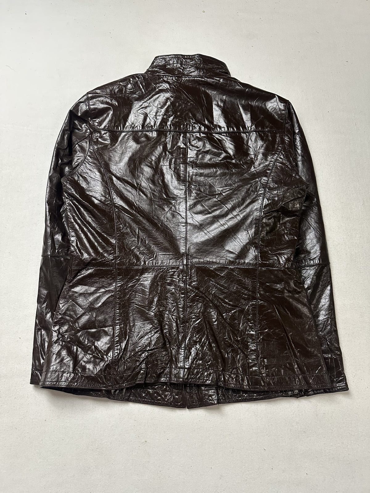 One of the four pockets on the brown leather field jacket