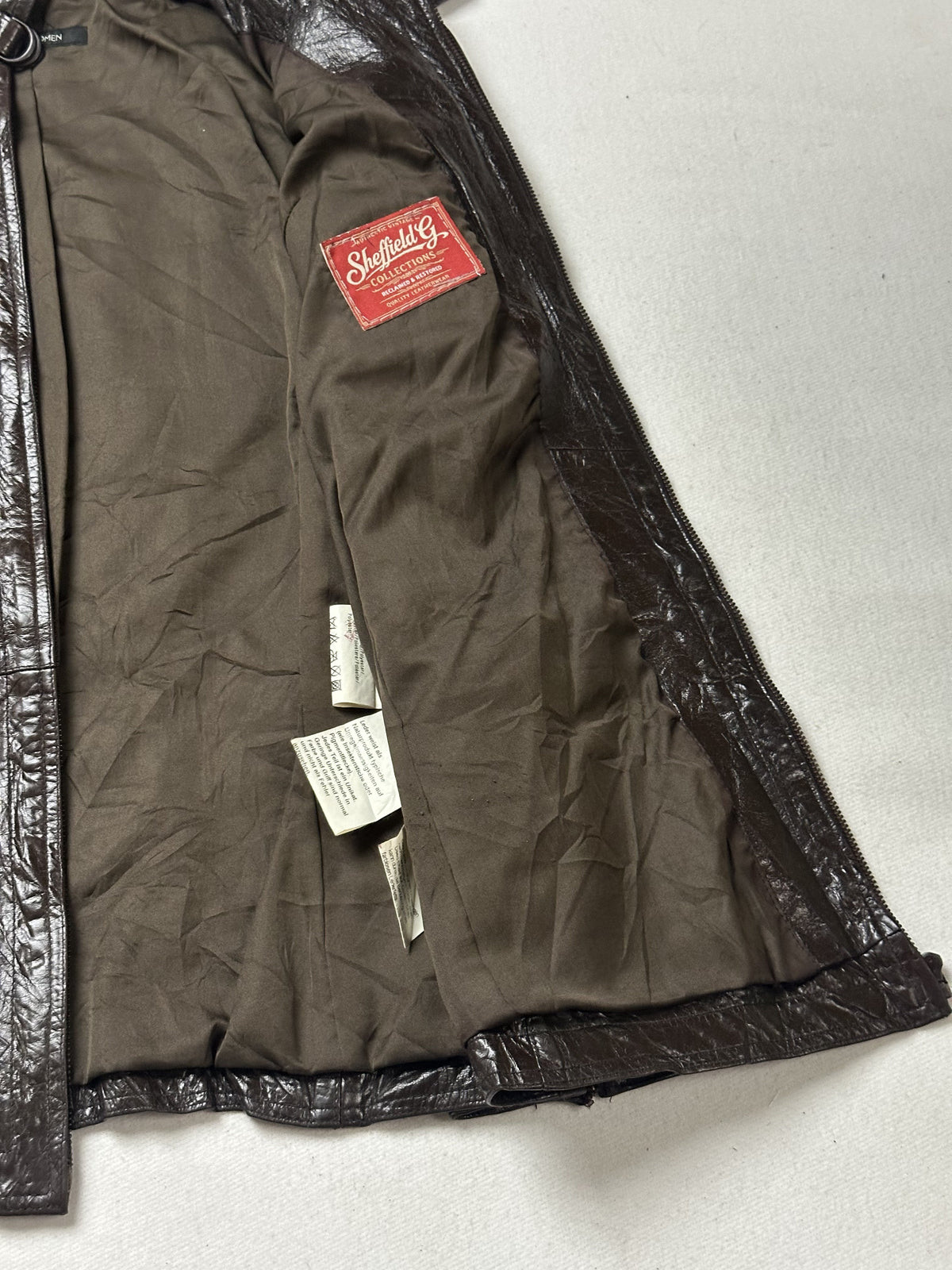 Brown real leather field jacket with a 23 inch sleeve, size M