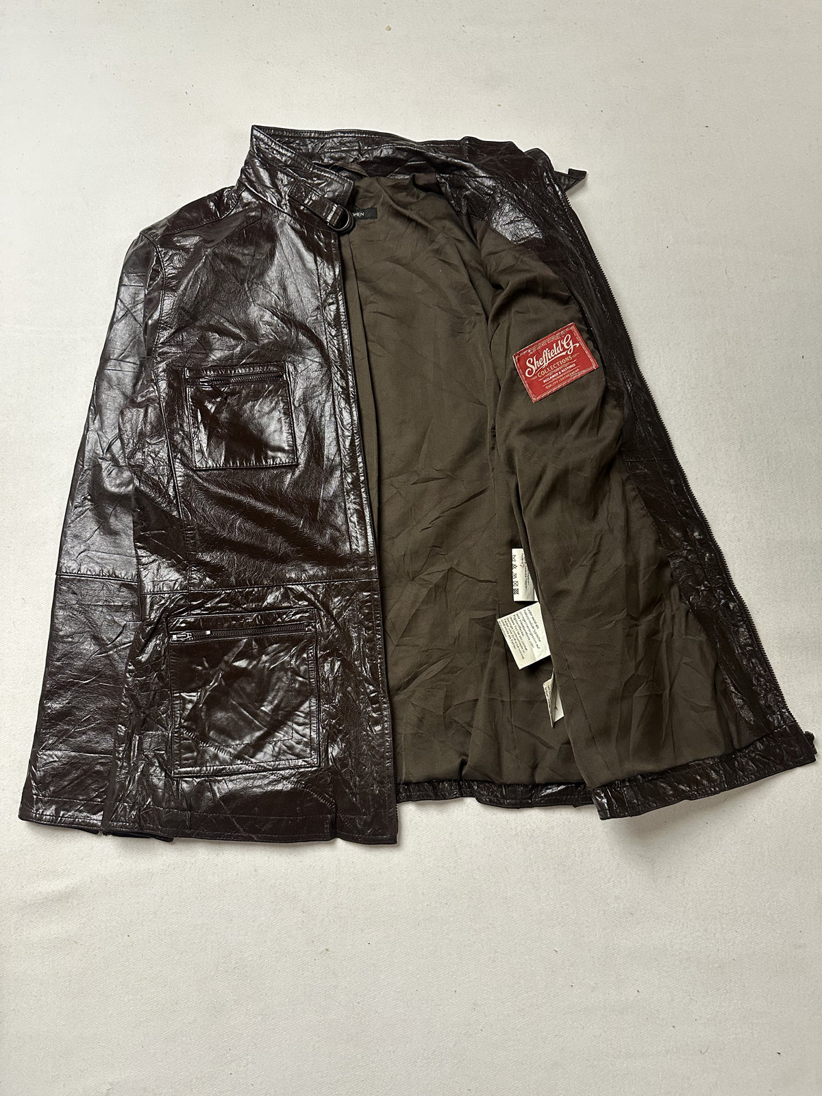 Narrow shouldered brown leather field jacket in size M