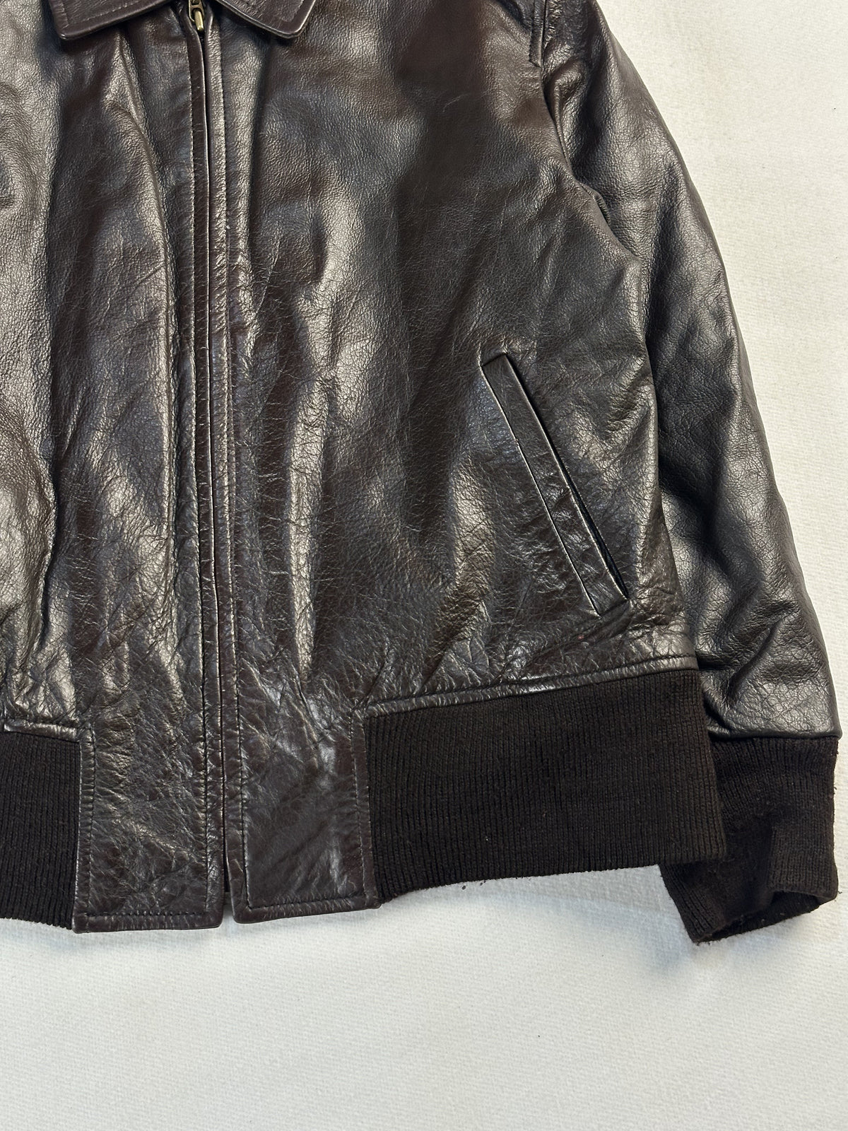 Brown leather flight jacket in very good condition, shown in size M