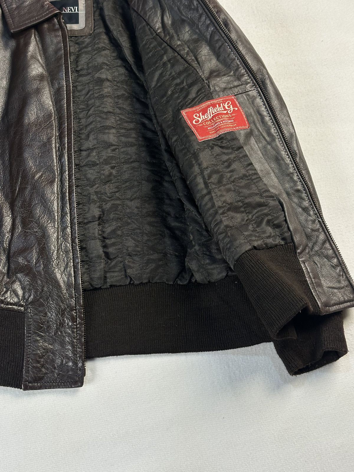 Brown real leather flight jacket with a 20 inch sleeve, size M