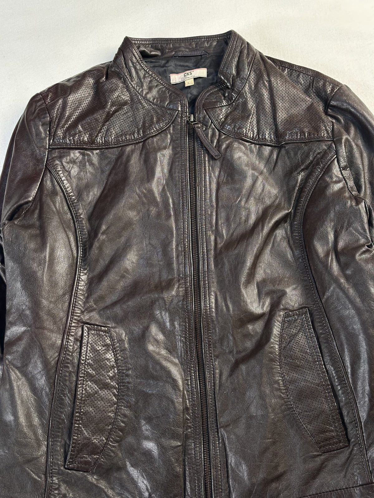 The size M brown cafe racer, 24 inches long through the body