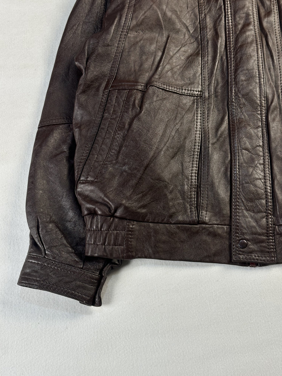 Slash pocket at the left hip sitting above the gathered elastic waistband