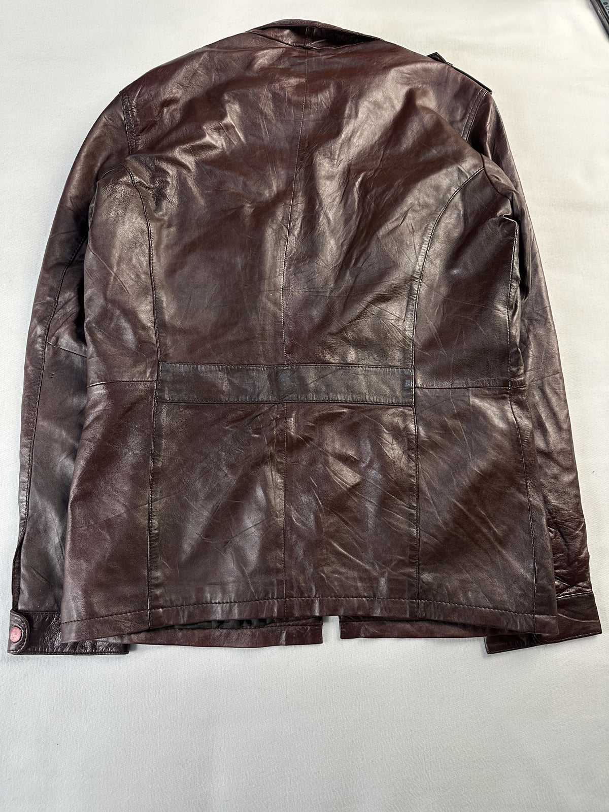 Flap pocket on the front of the brown leather field jacket