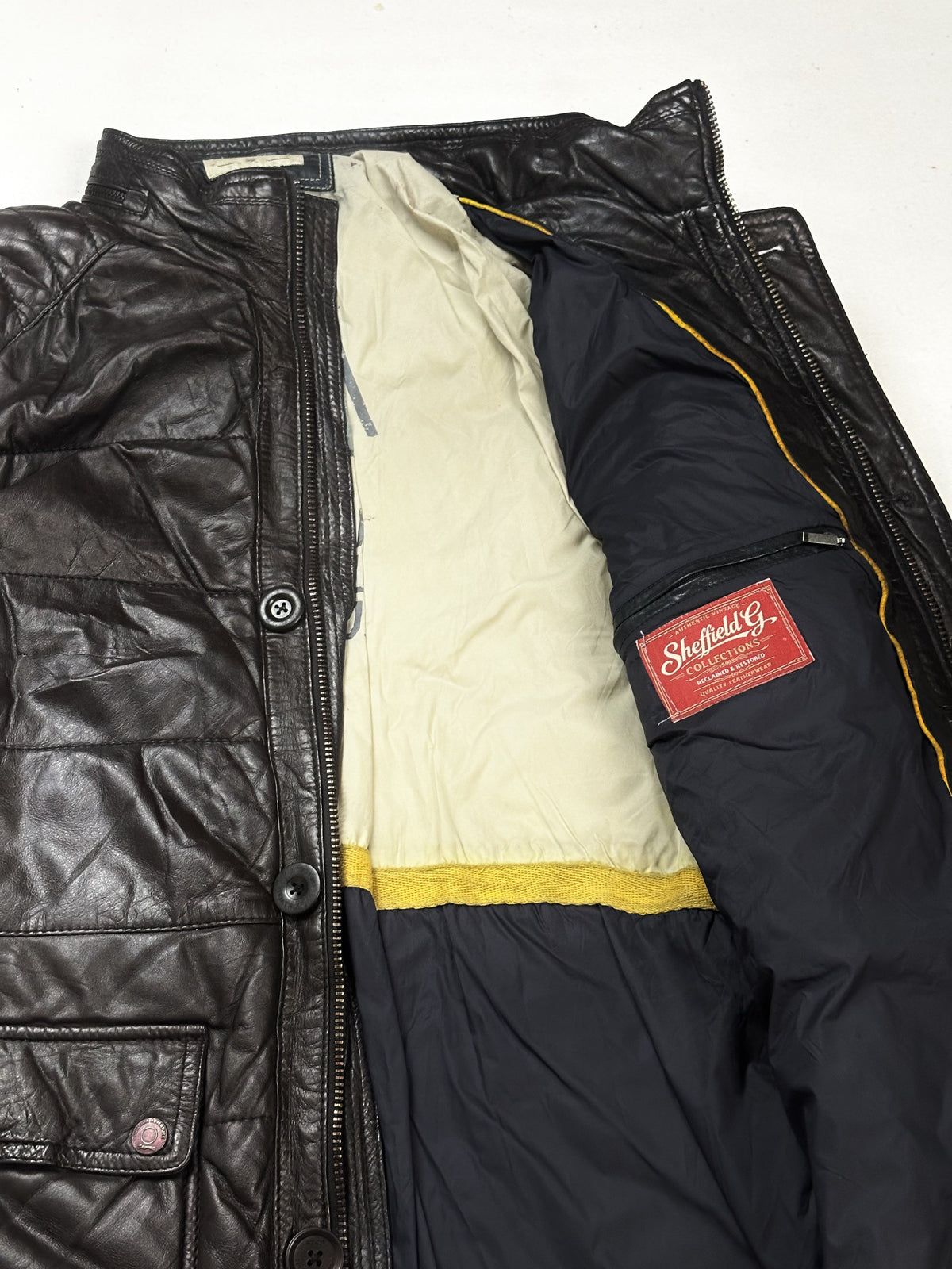 Quilted brown leather jacket in size L with a 19 inch shoulder