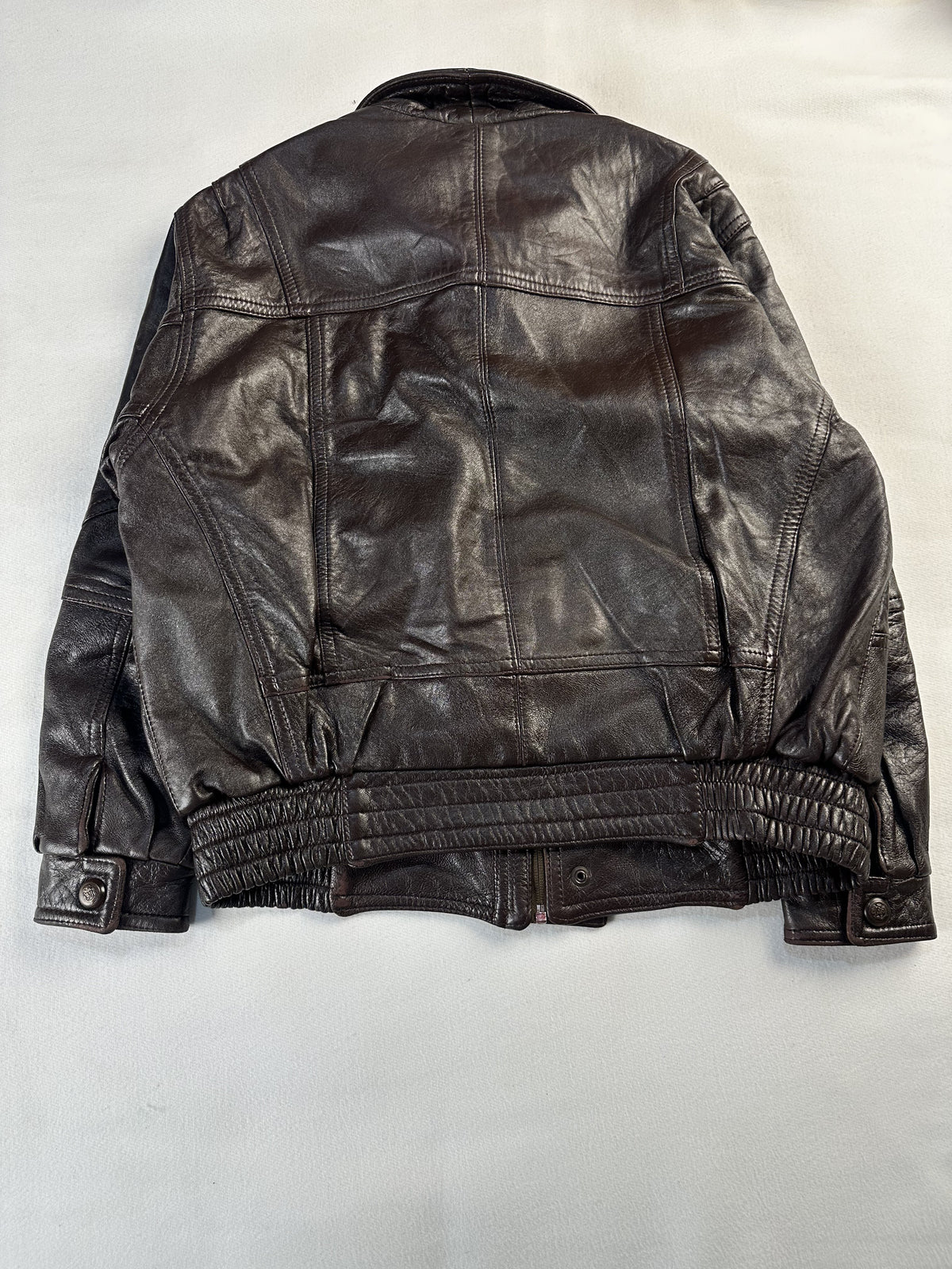 Diamond stitching across a pocket on the brown leather trucker