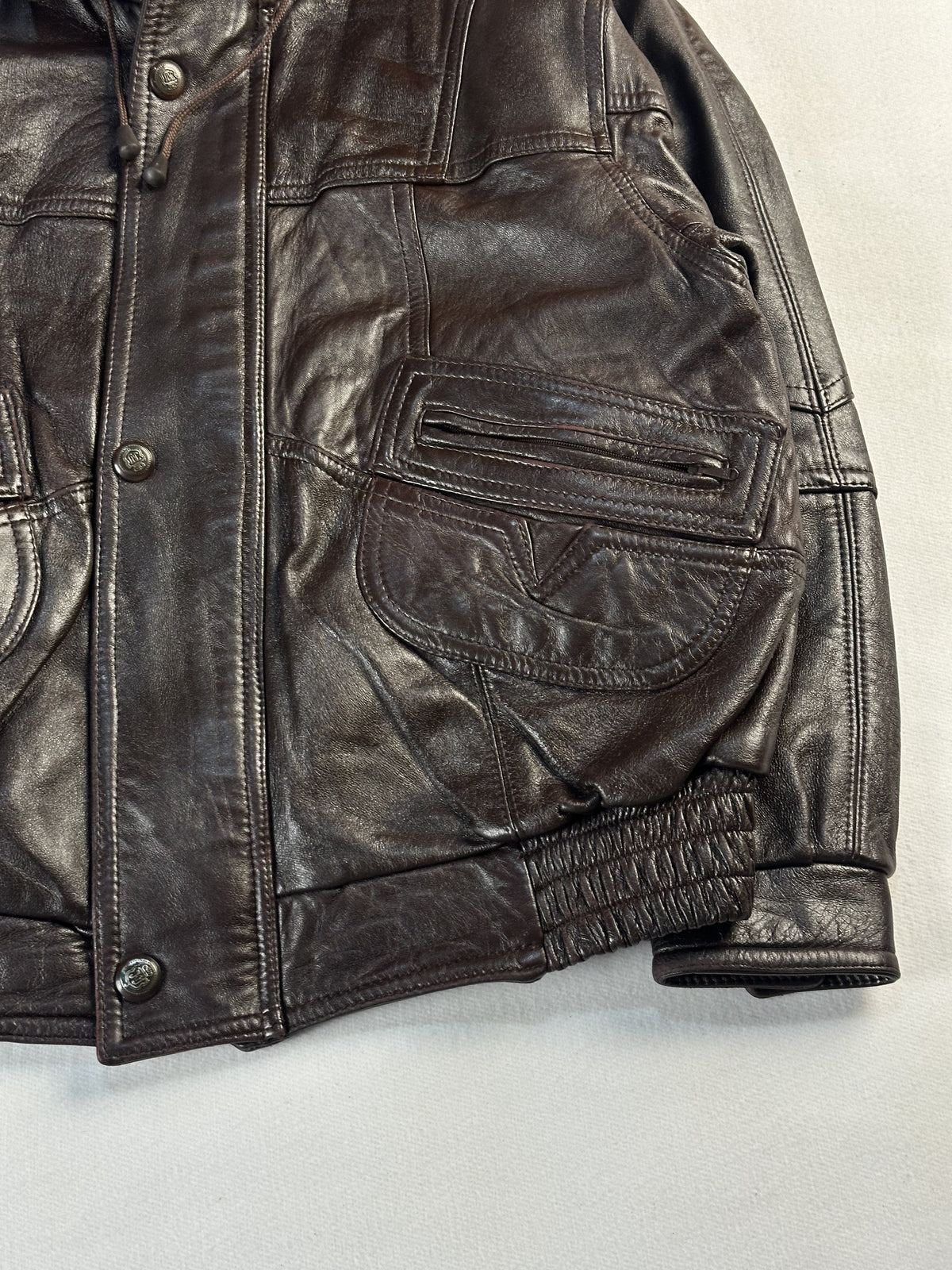 Brown leather trucker jacket in very good condition, shown in size L