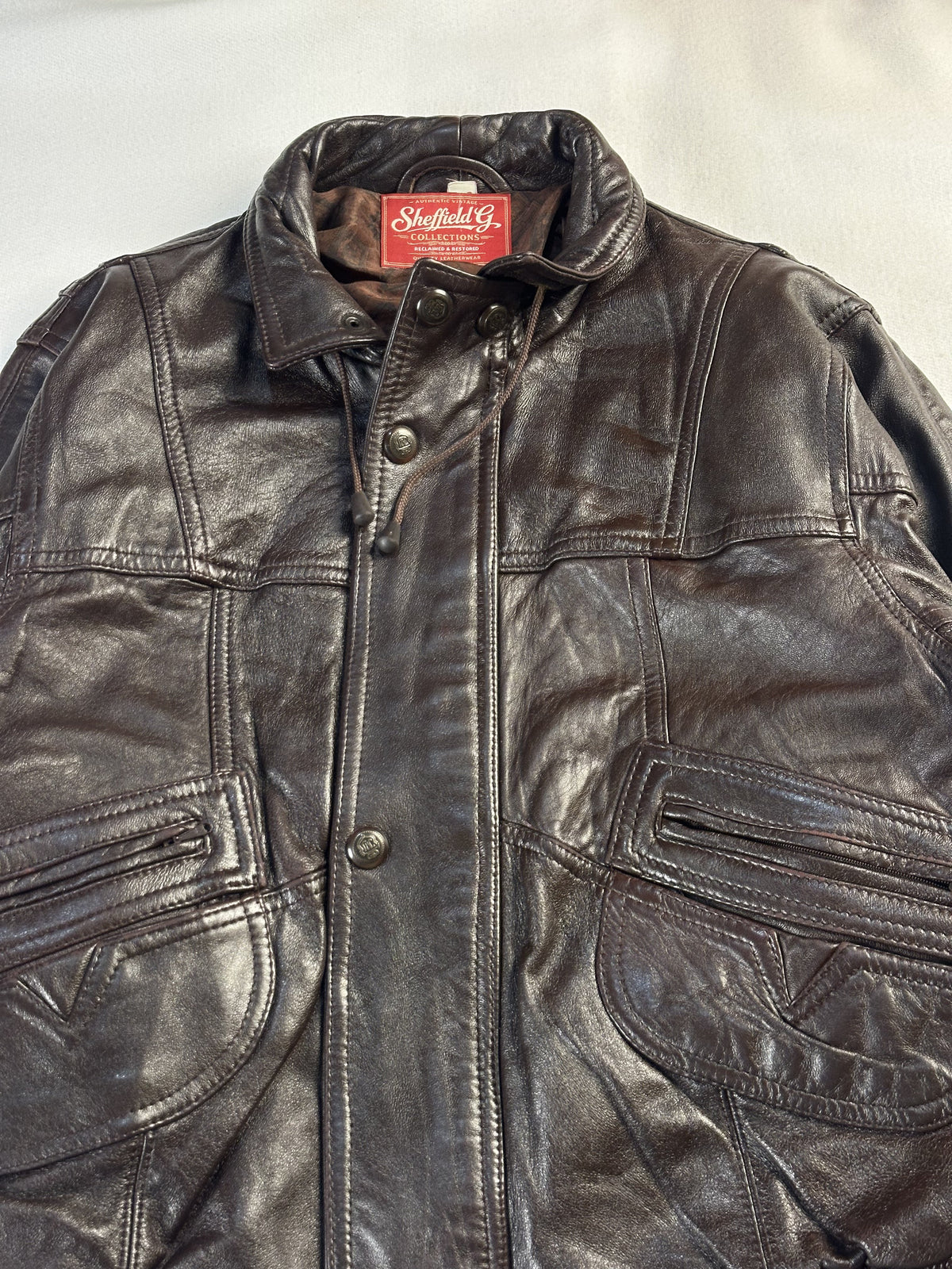 The size L brown trucker, 25 inches long through the body