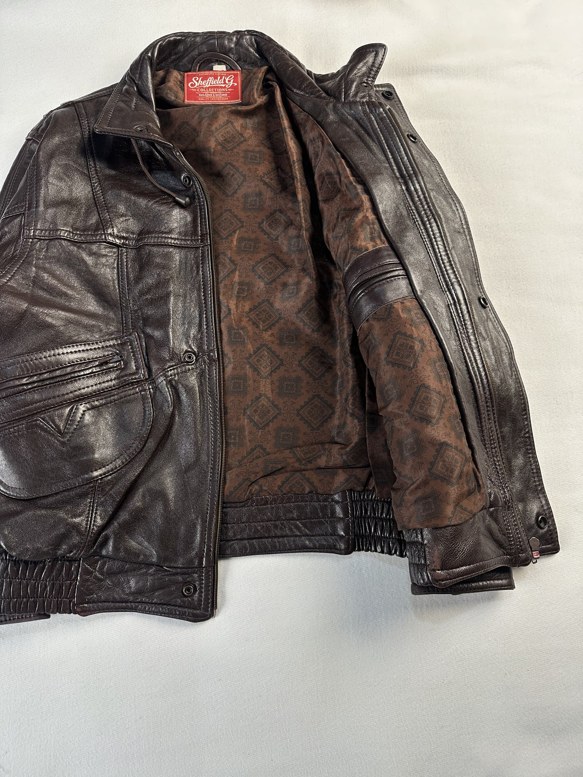 Brown real leather trucker jacket with a 22 inch sleeve, size L
