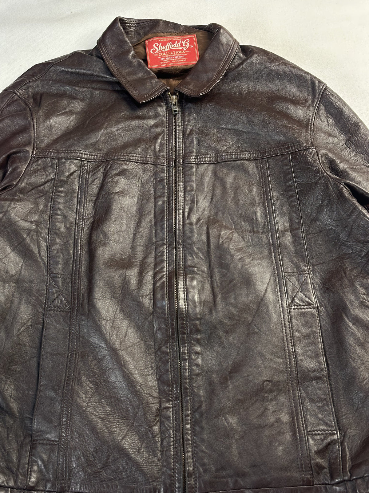 The size L brown harrington, 25 inches long through the body