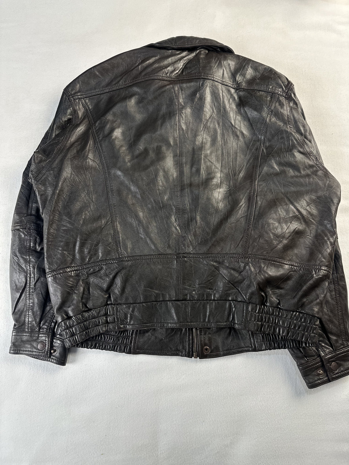 Zipped chest pocket on the brown leather harrington