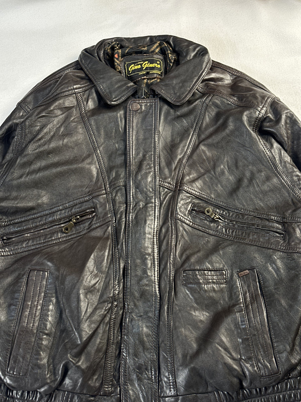 The size L brown harrington, 25 inches long through the body