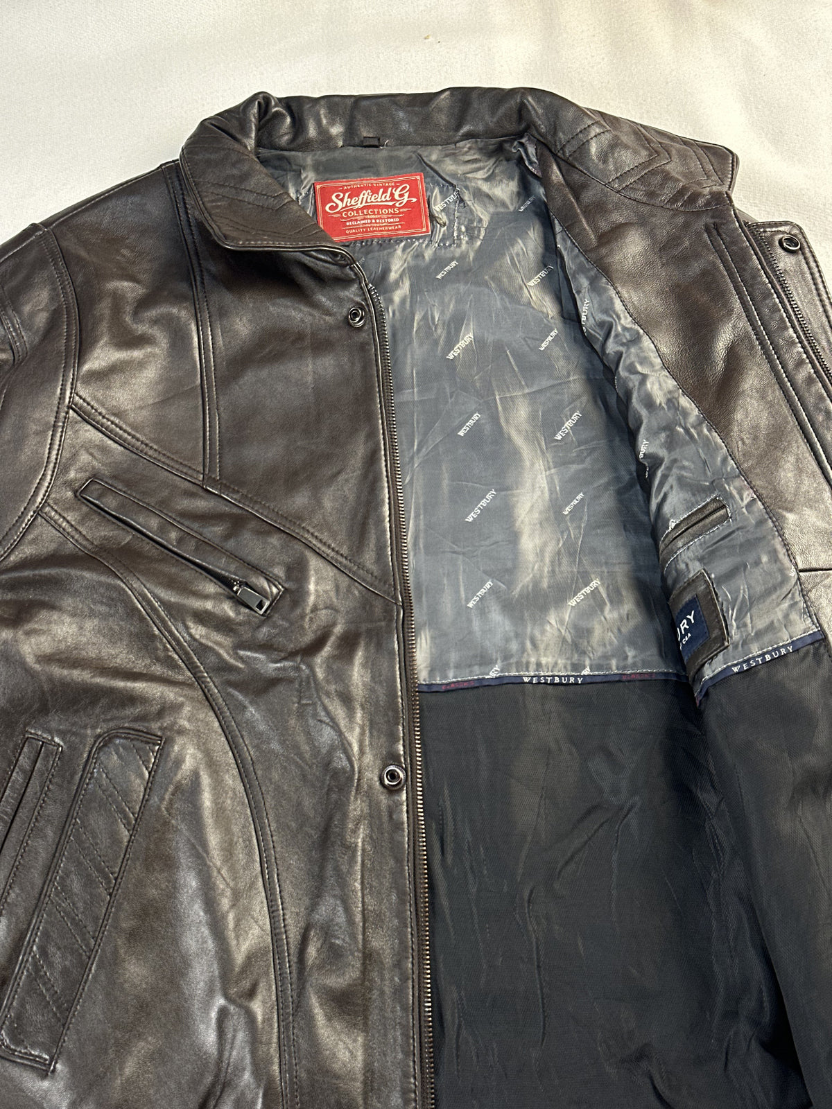 The size XL brown cafe racer, 27 inches long through the body