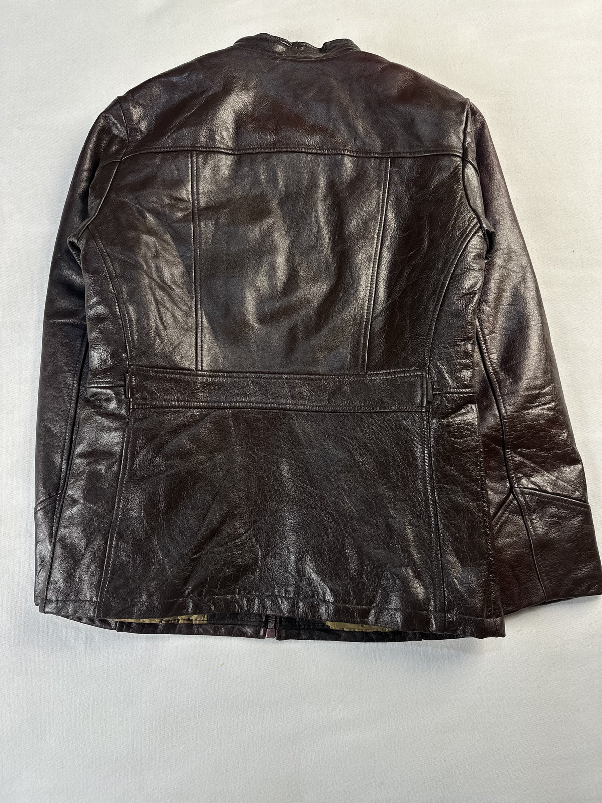 Back of the small brown cafe racer showing the panelled seams and lower yoke
